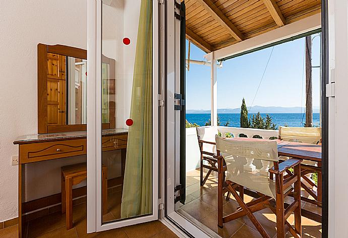 Double bedroom with A/C and balcony access . - Dolphin Villa 1 . (Photo Gallery) }}