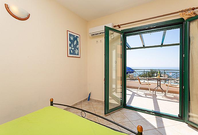 Double bedroom on ground floor with en suite bathroom, A/C, and terrace access with sea views . - Villa Vera . (Galleria fotografica) }}