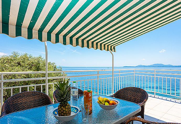 Upper terrace area with sea views . - Villa Thalassa . (Photo Gallery) }}