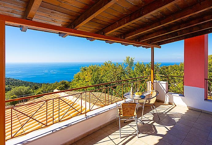 Upper sheltered terrace area with panoramic sea views . - Villa Aetos . (Photo Gallery) }}