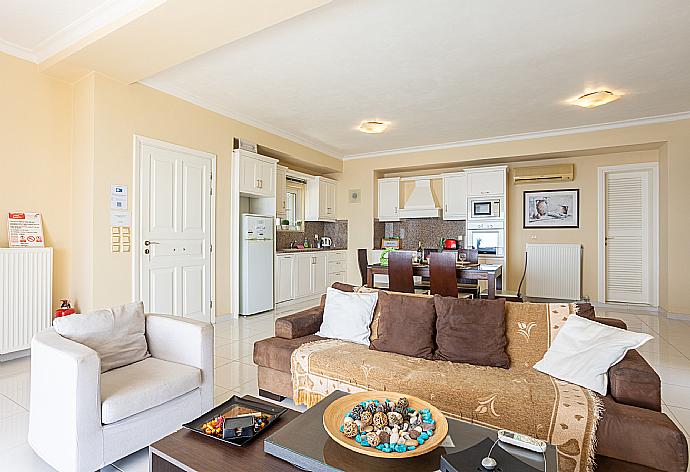 Open-plan living room with sofa, dining area, kitchen, WiFi internet, satellite TV, and sea views . - Villa Magda . (Fotogalerie) }}