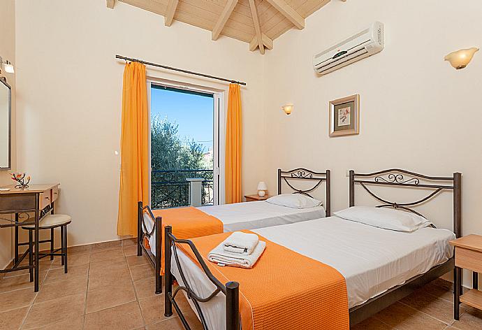 Twin bedroom with A/C and balcony access . - Villa Belvedere Rosa . (Photo Gallery) }}