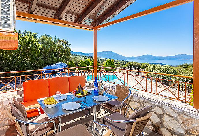 Sheltered terrace area with sea views . - Villa Yeraki . (Photo Gallery) }}