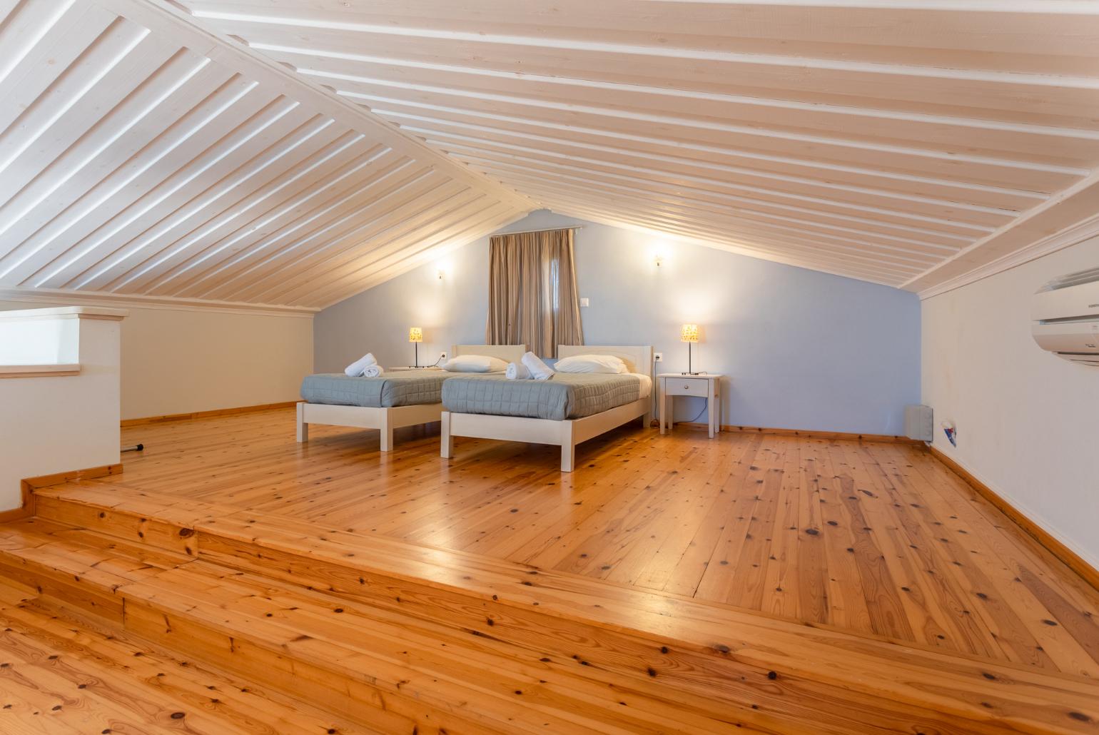 Twin bedroom on mezzanine with A/C