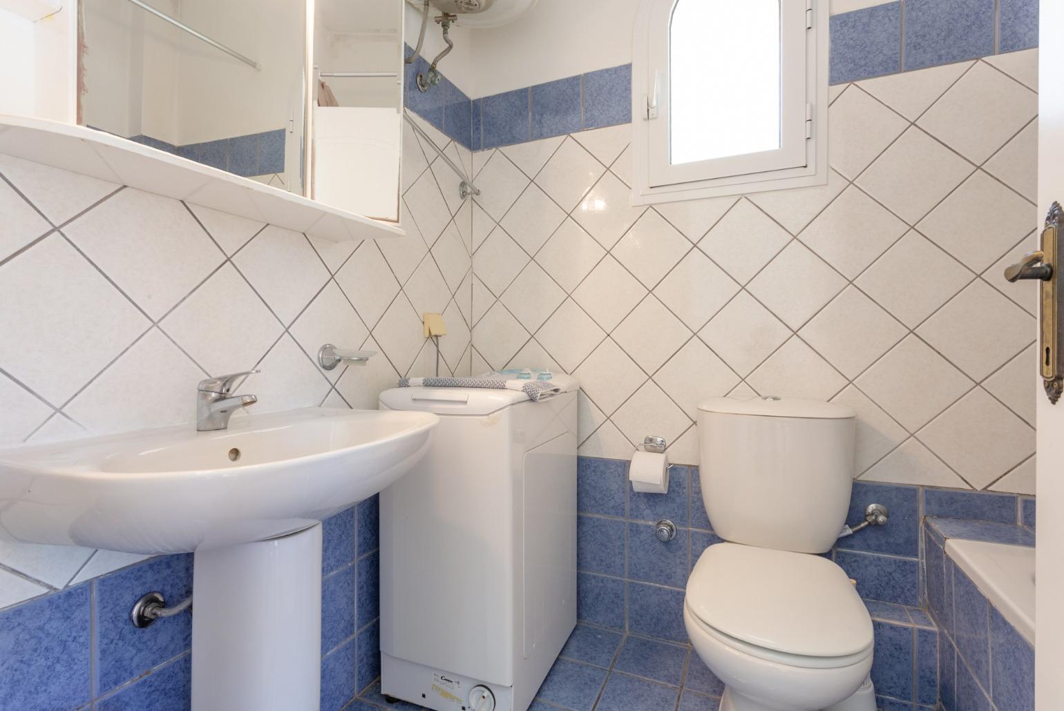 Family bathroom with bath and overhead shower