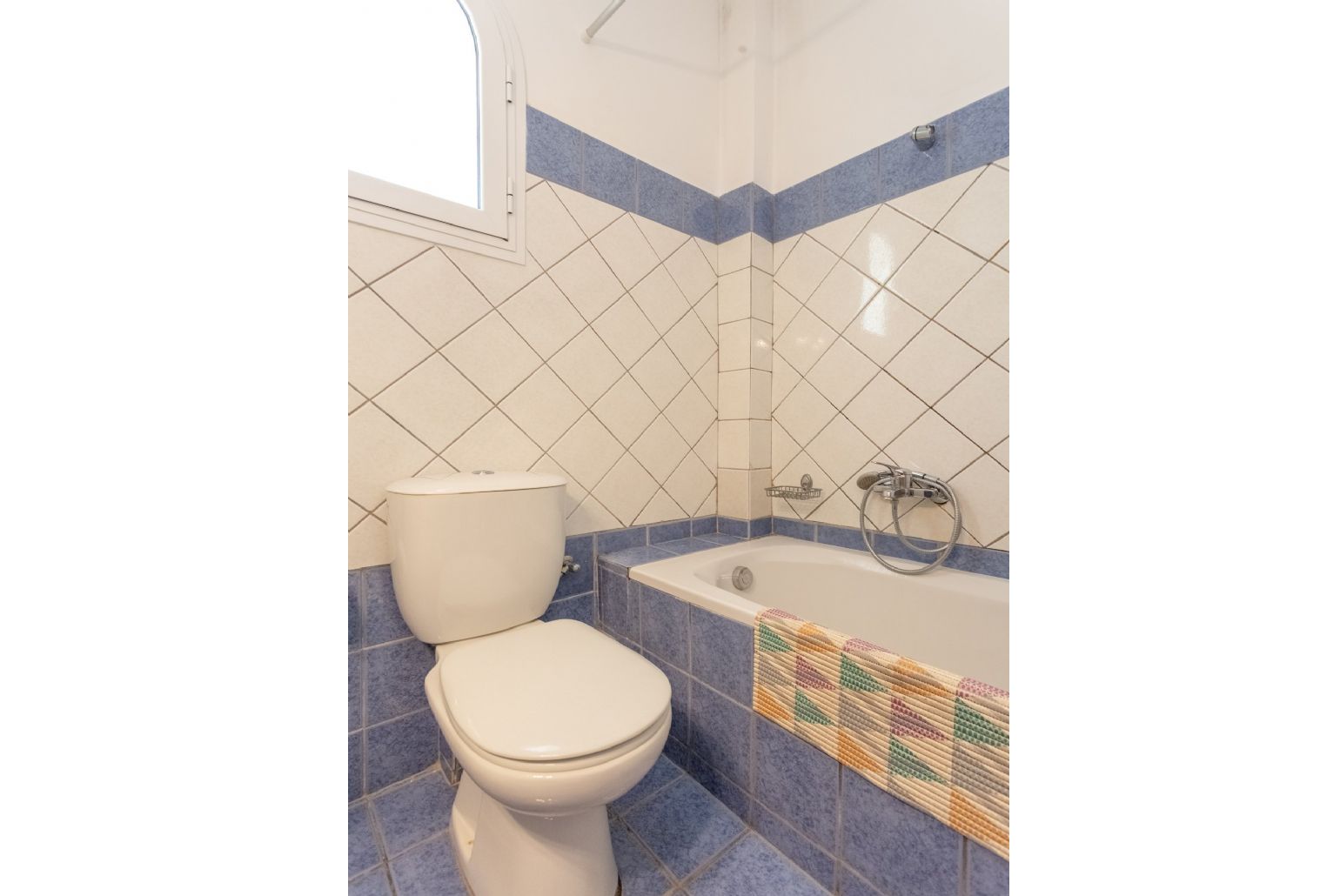 Family bathroom with bath and overhead shower