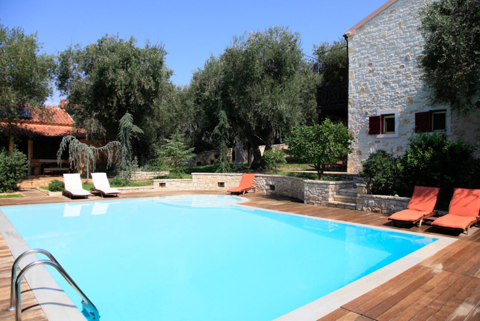 Private swimming pool with garden and terrace area