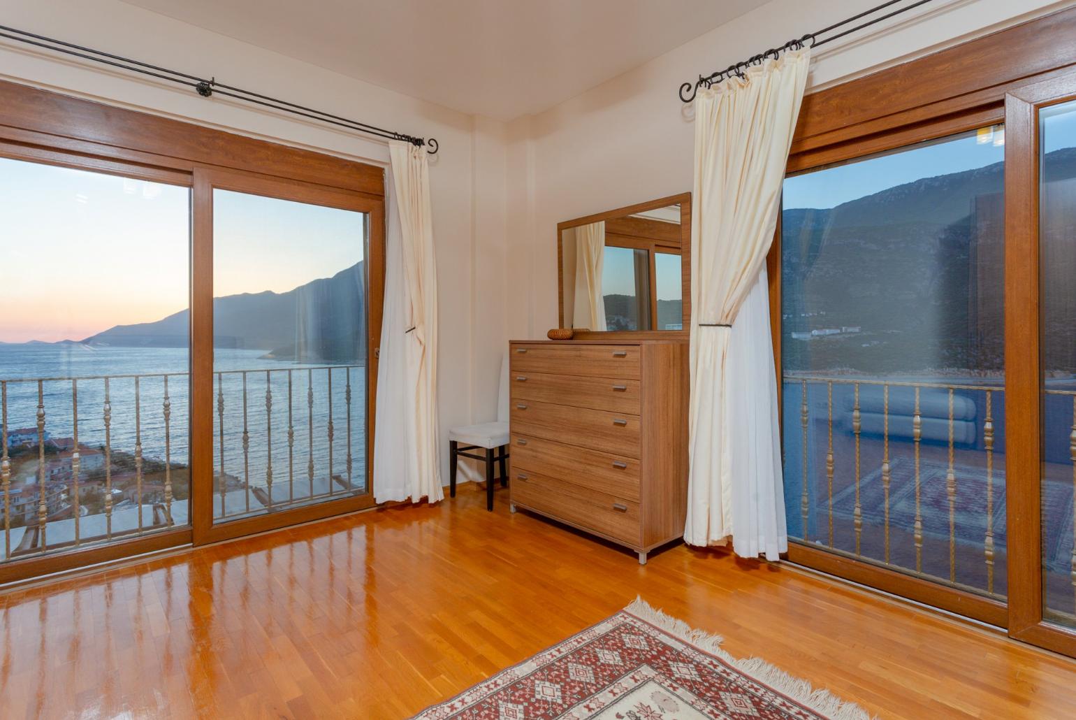 Double bedroom with en suite bathroom, A/C, and panoramic sea views