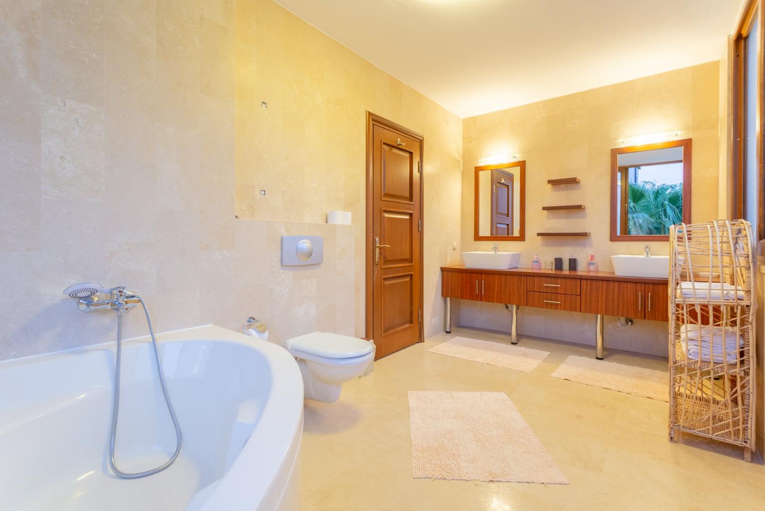 En suite bathroom with spa bath and shower