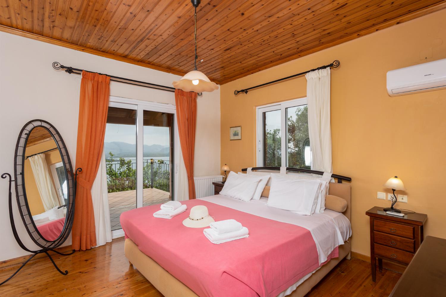 Double bedroom on first floor with en suite bathroom, A/C, and sea views