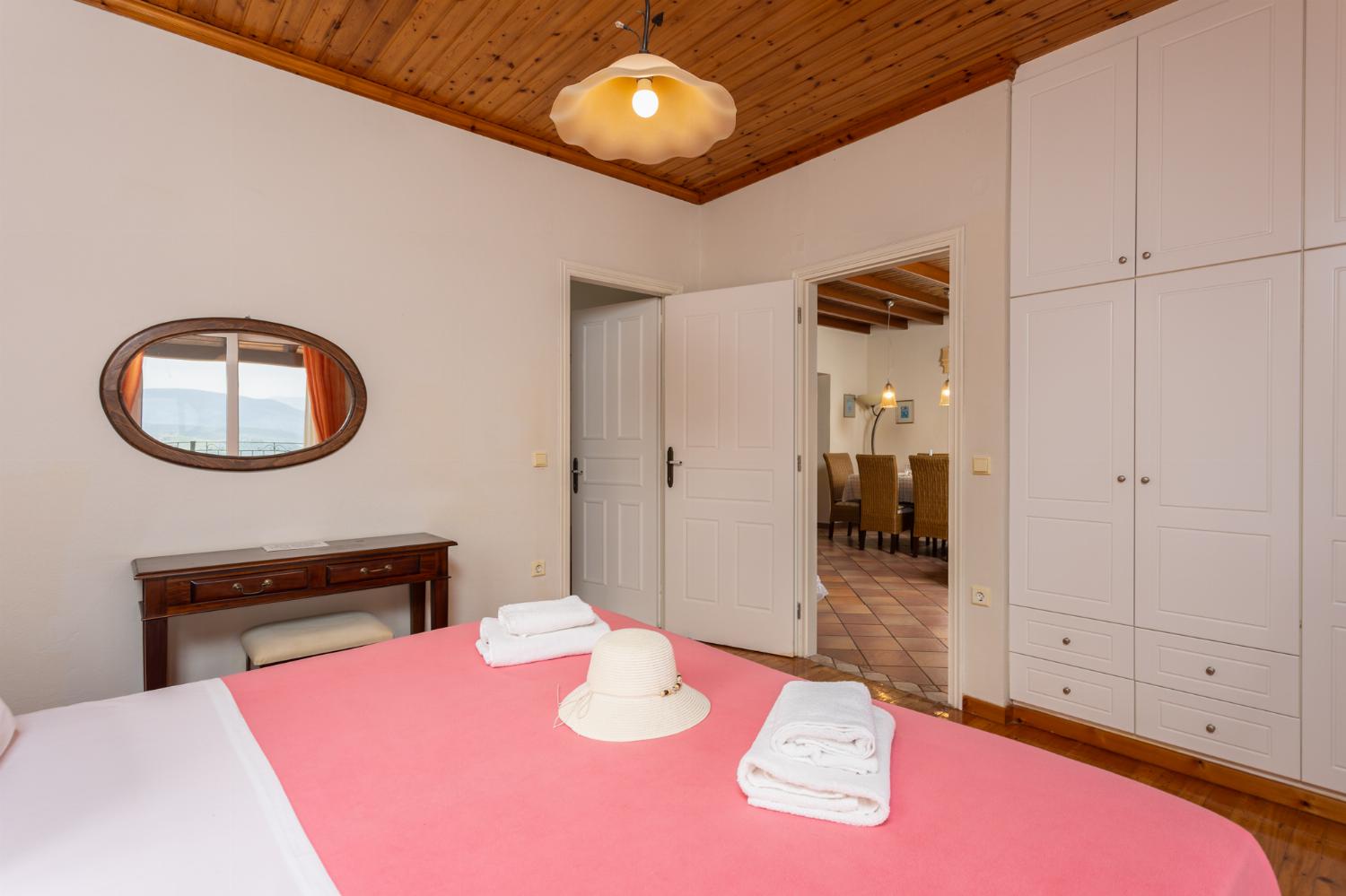 Double bedroom on first floor with en suite bathroom, A/C, and sea views