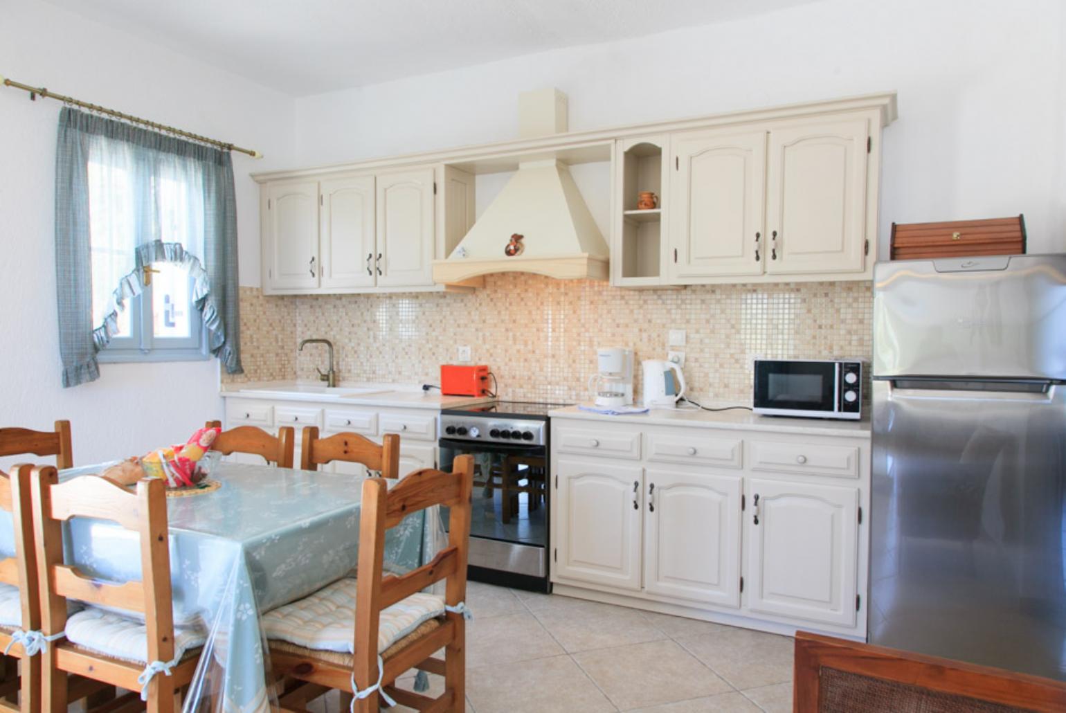 Equipped open plan kitchen and dining area