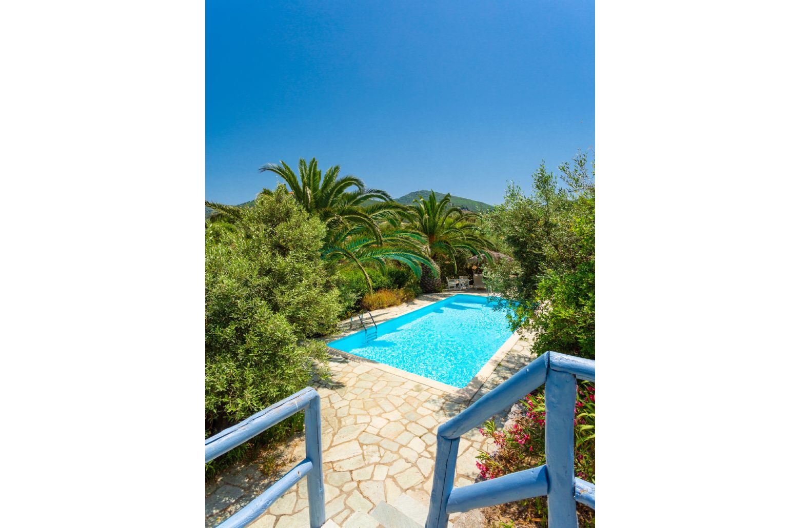 Stairway between villa and pool terrace