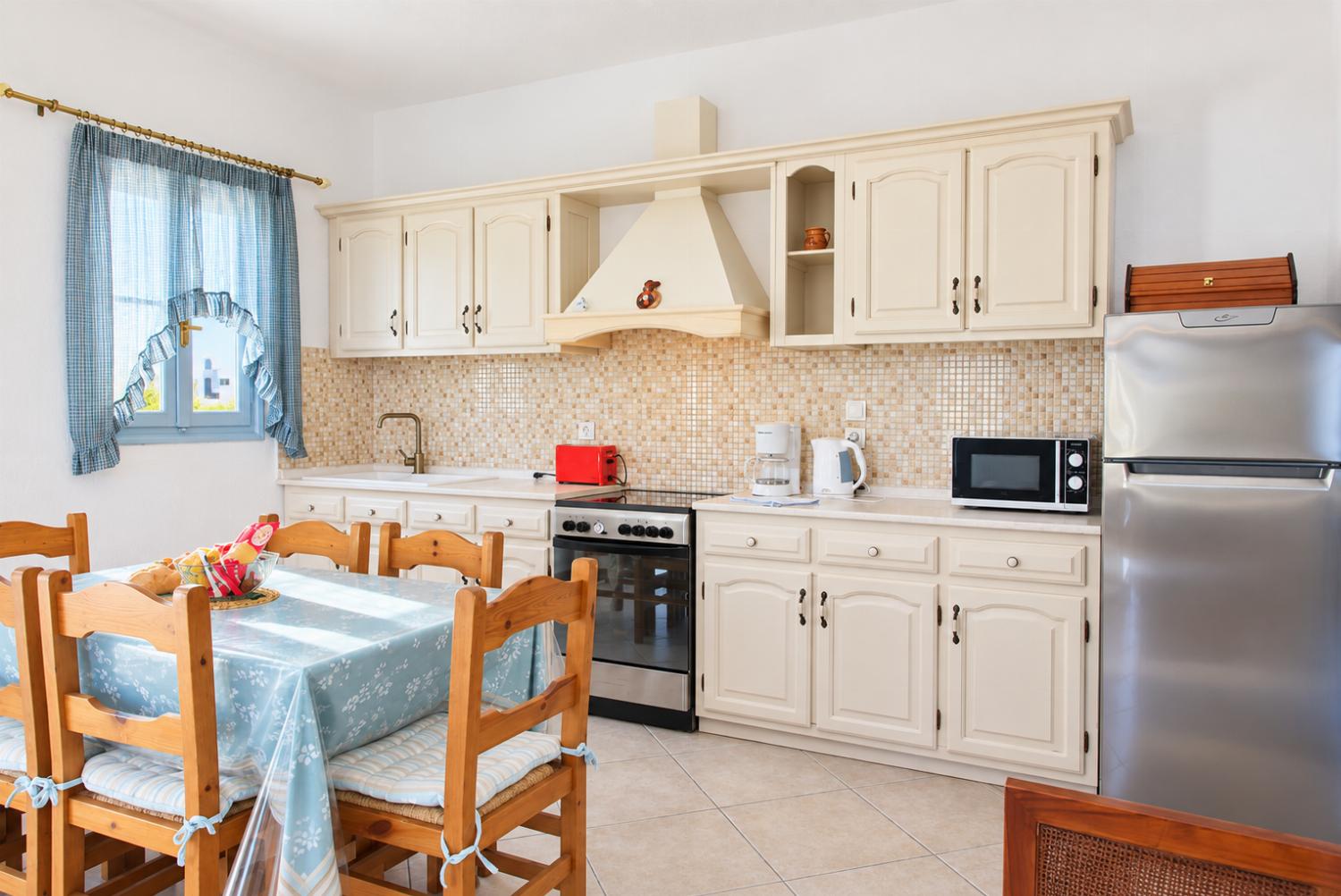Equipped open plan kitchen and dining area