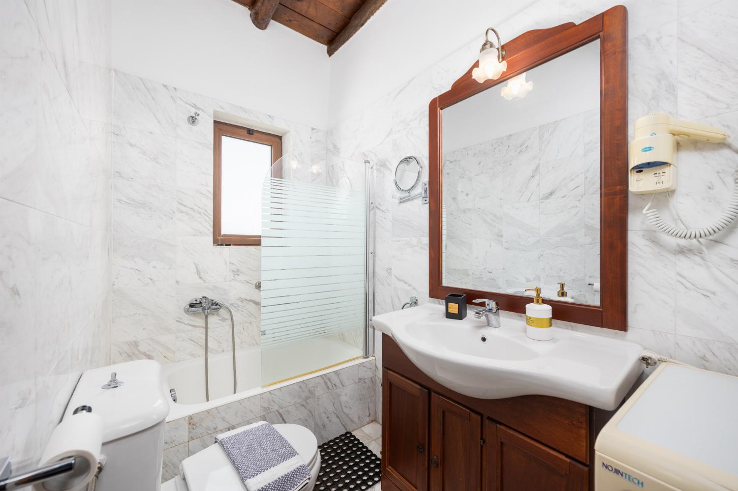 Family bathroom with bath and shower
