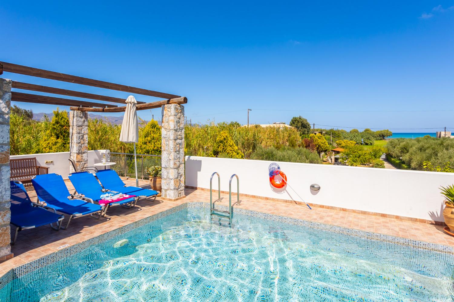 Private pool, garden, and terrace with sea views