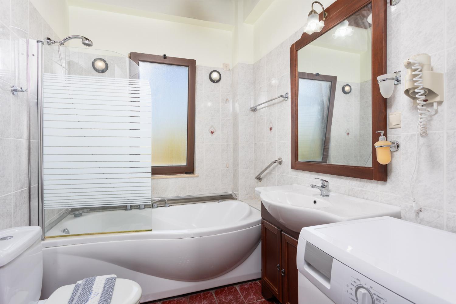 Family bathroom with bath and shower