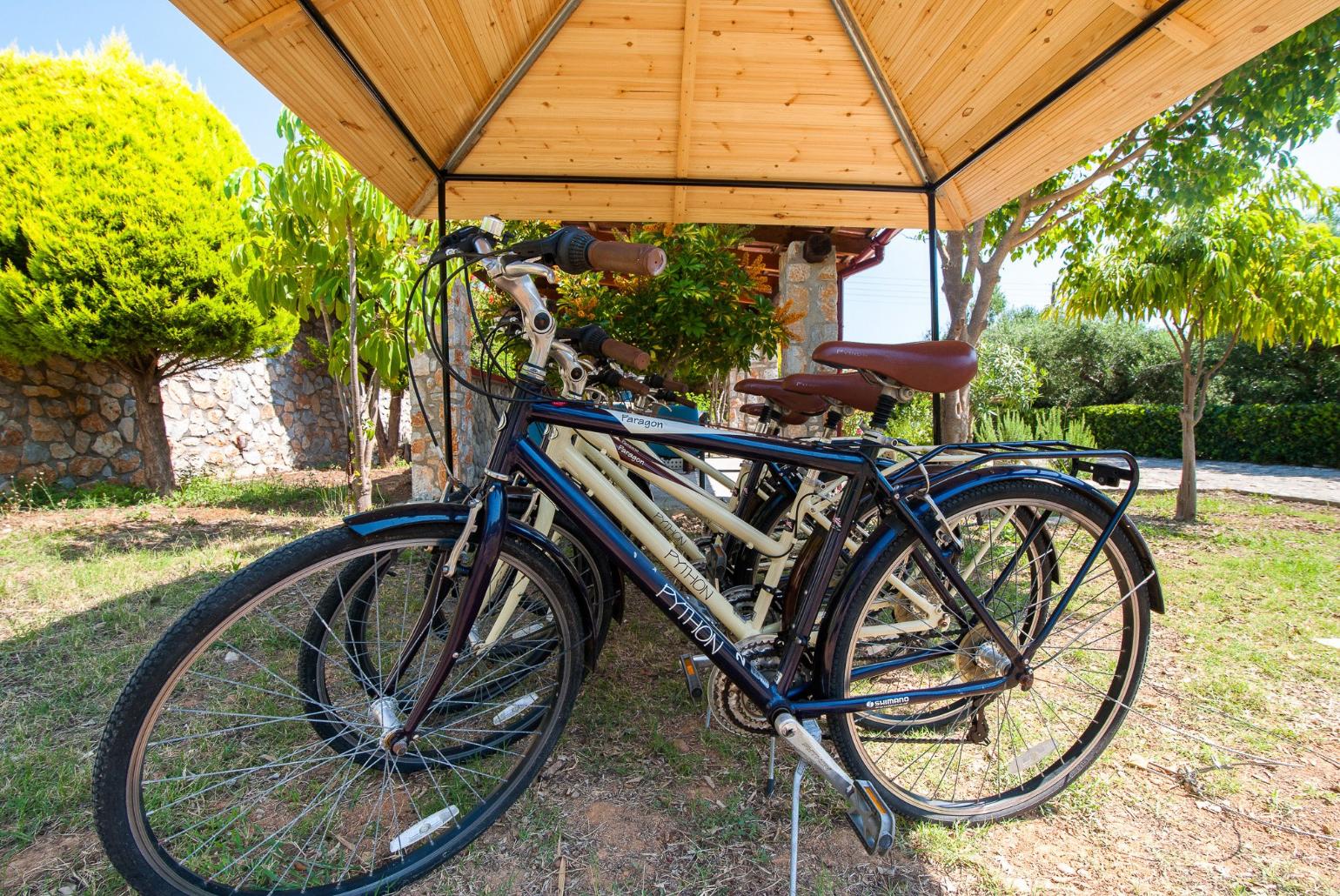 Bikes in shared garden area of Eleon Villas