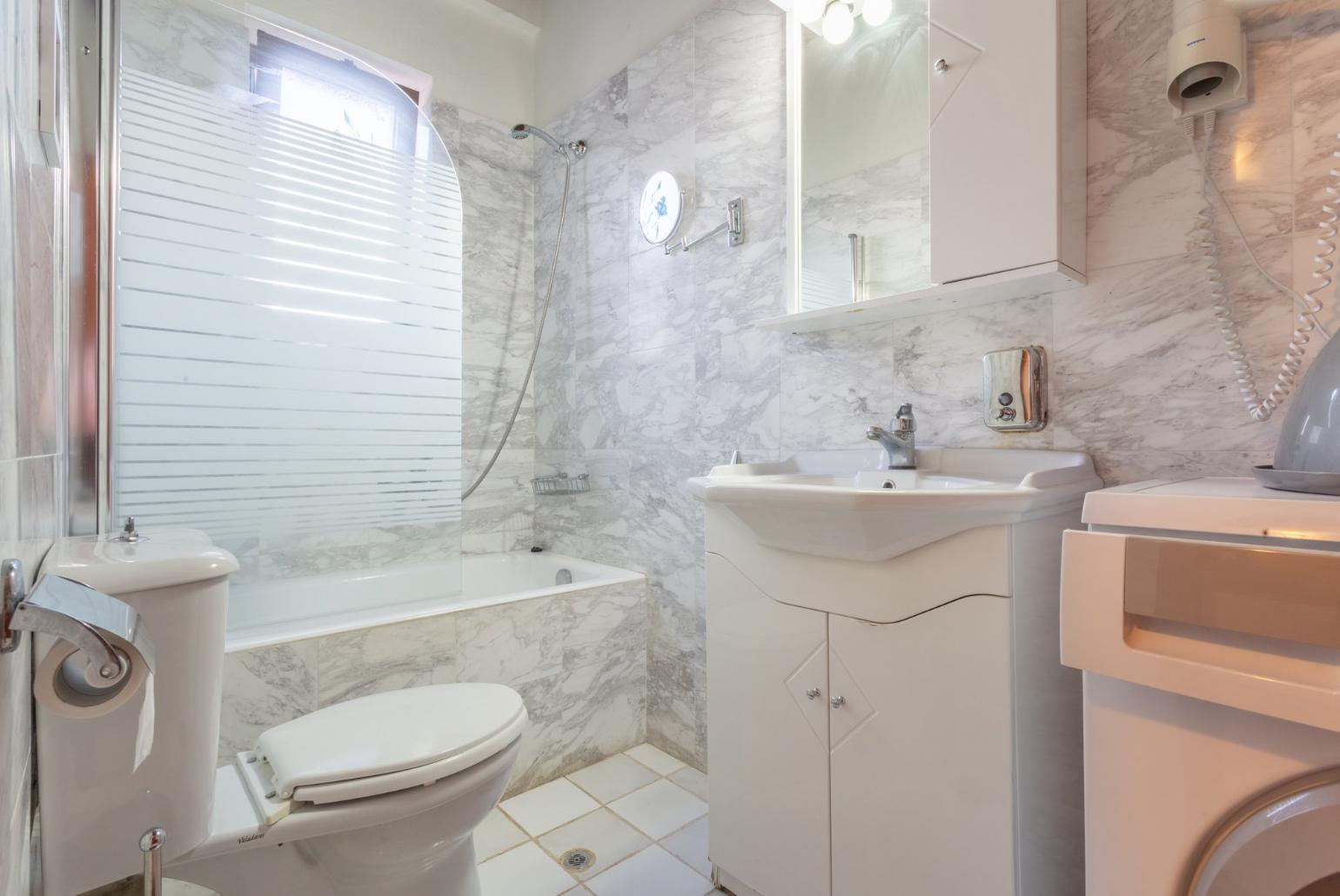 Family bathroom with bath and shower