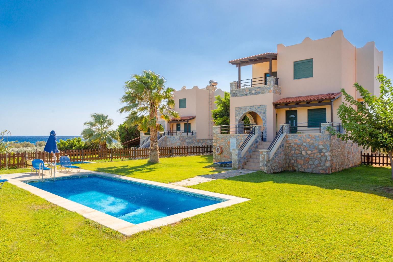 Beautiful villa with private pool, lawn, and terrace with sea views