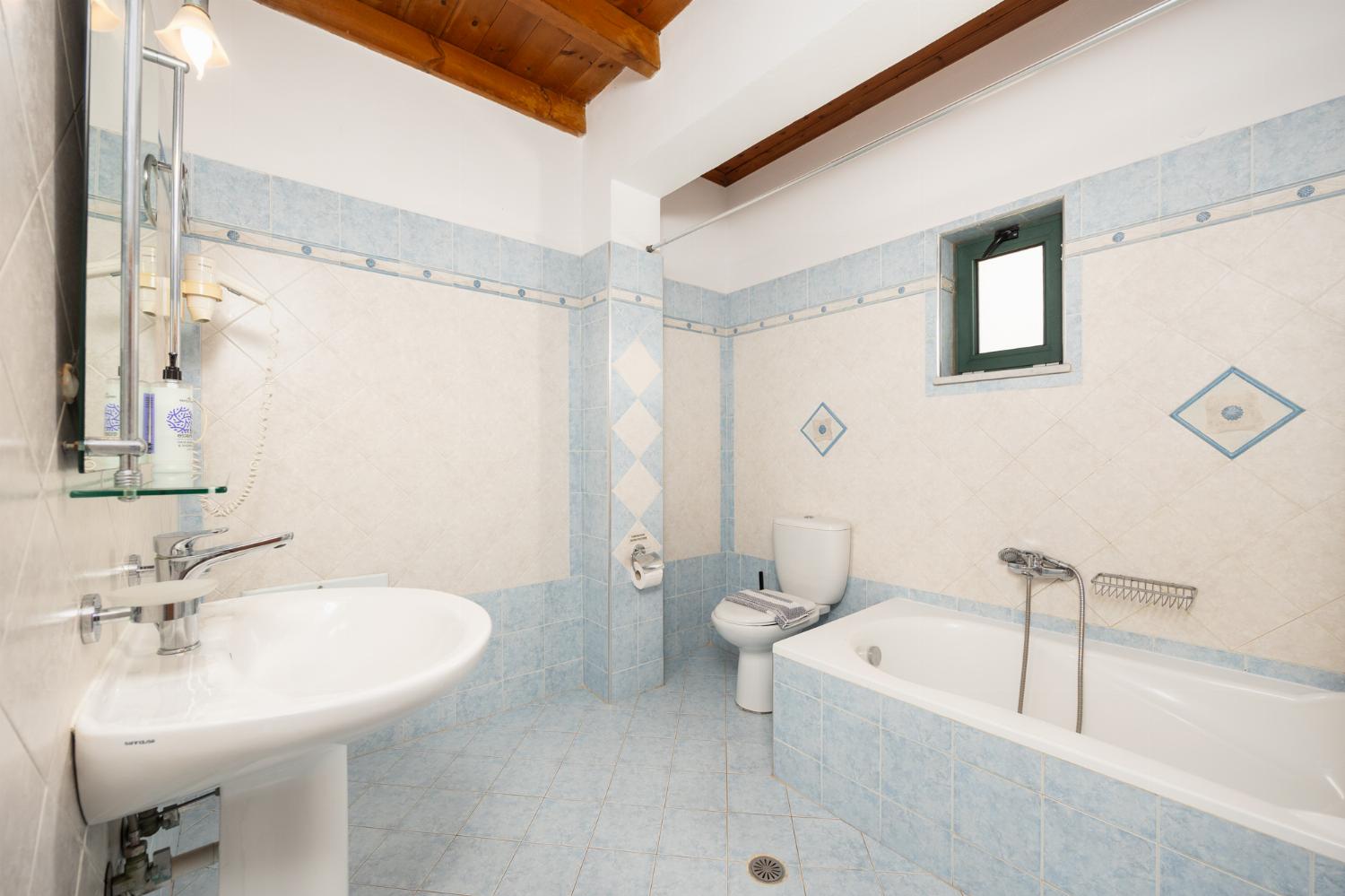 Family bathroom with bath and shower