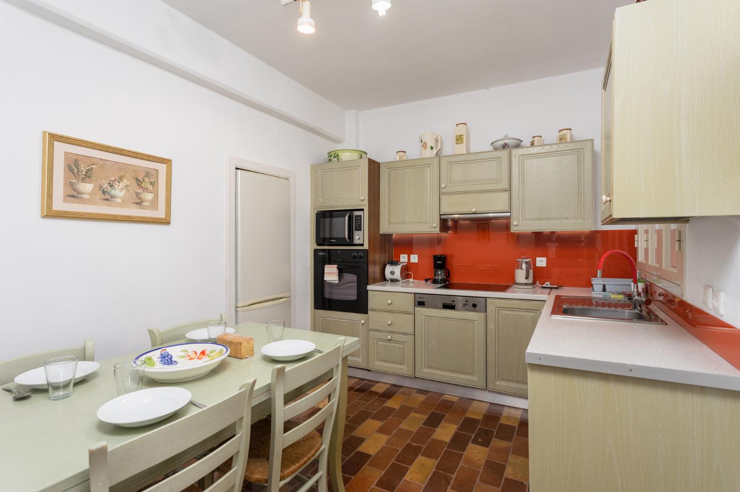 Equipped kitchen on ground floor with dining area