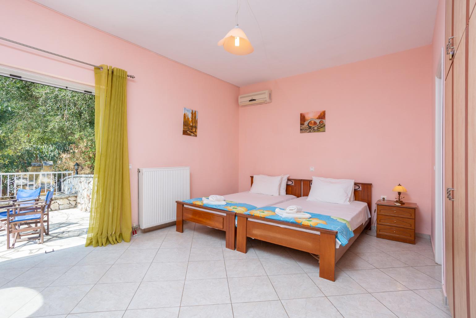 Twin bedroom with en suite bathroom, A/C, and upper terrace access with sea views