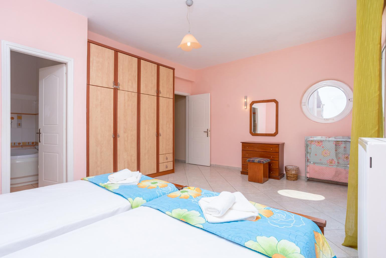 Twin bedroom with en suite bathroom, A/C, and upper terrace access with sea views