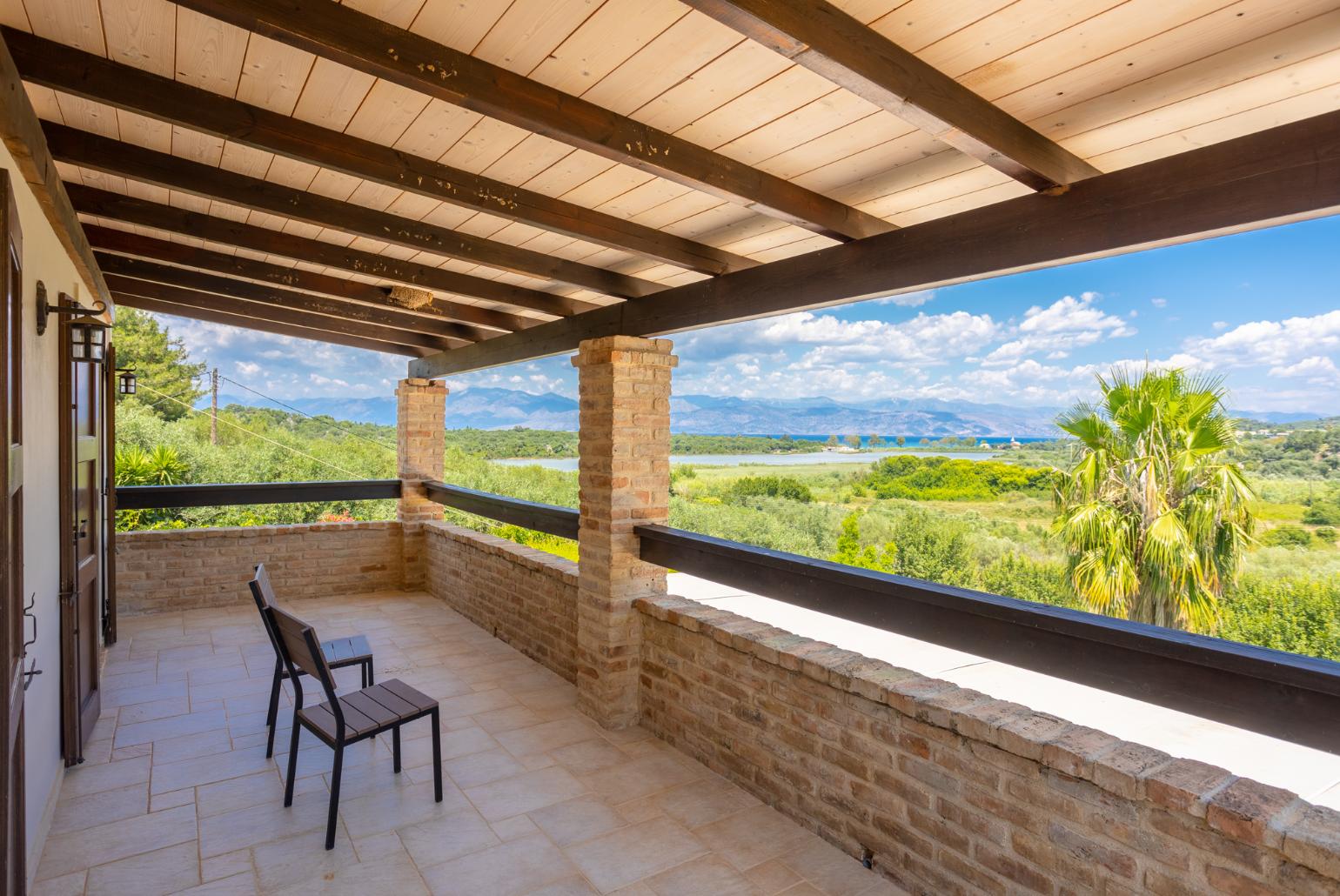 Sheltered upper terrace area with sea views