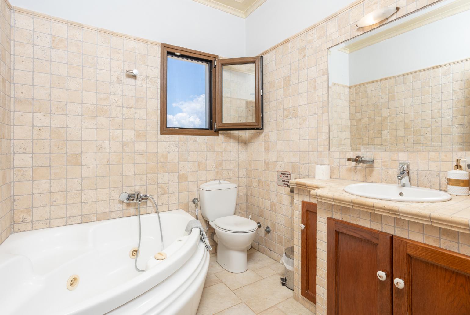 Family bathroom with bath and shower