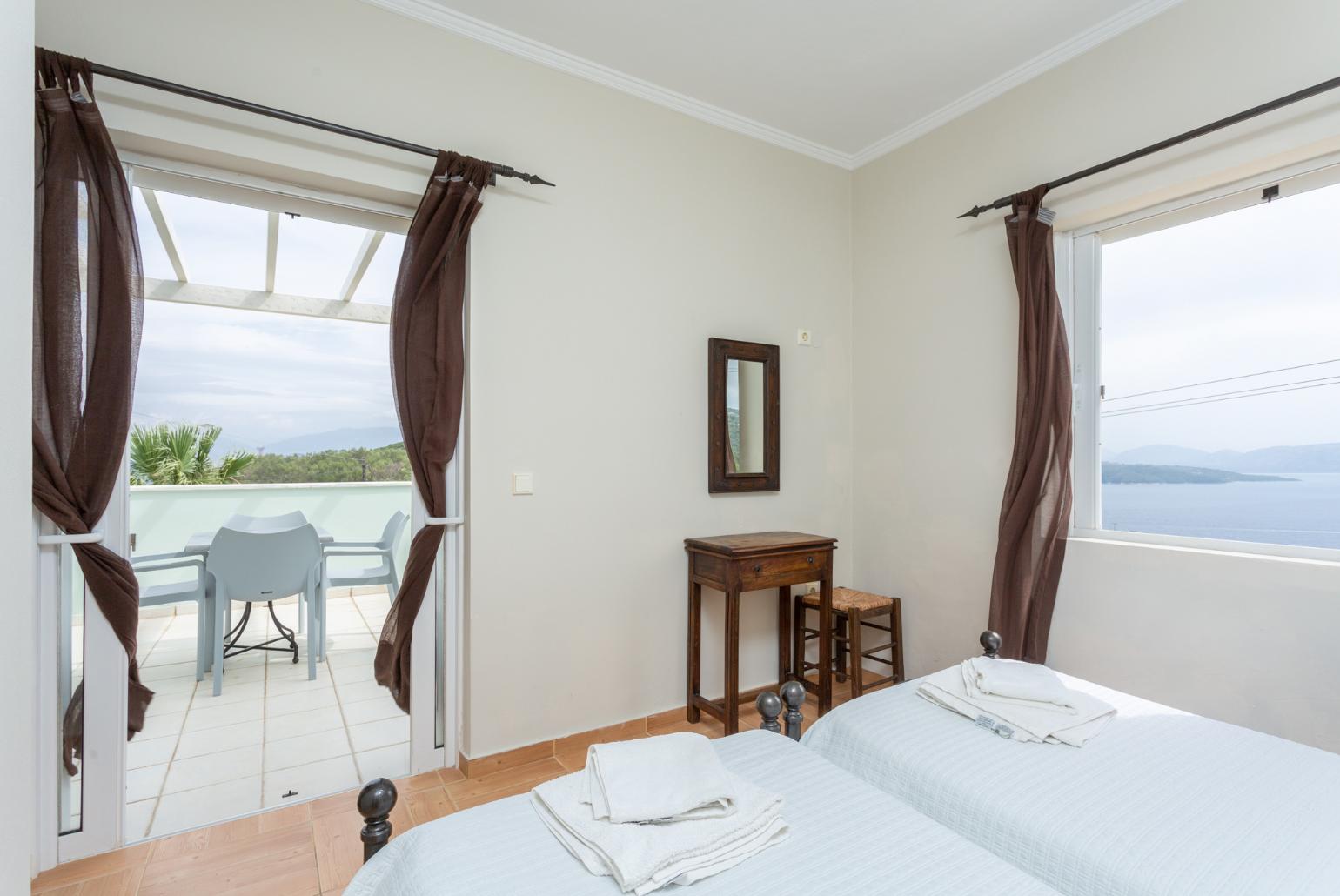 Twin bedroom with en suite bathroom, A/C, and upper terrace access with sea views