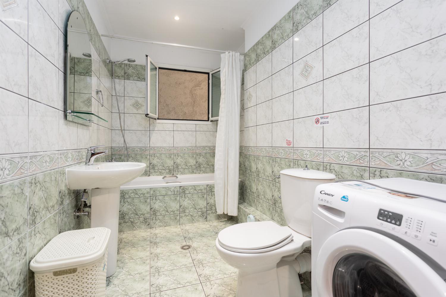 Family bathroom with bath and shower