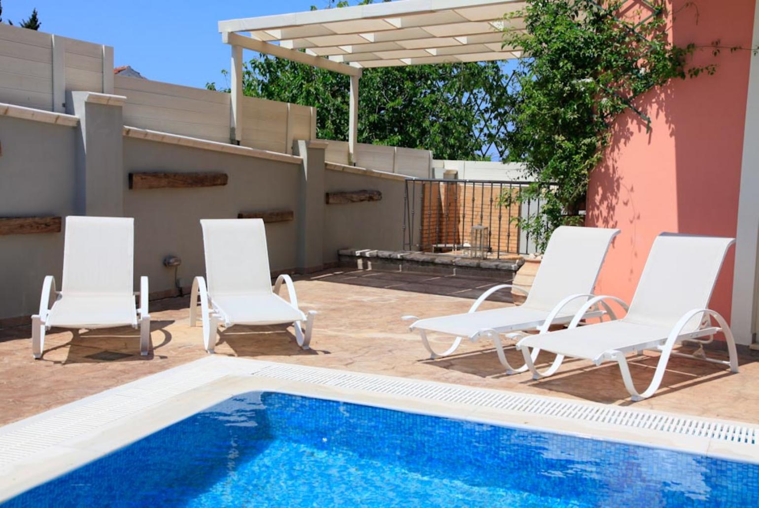Private pool with sun loungers