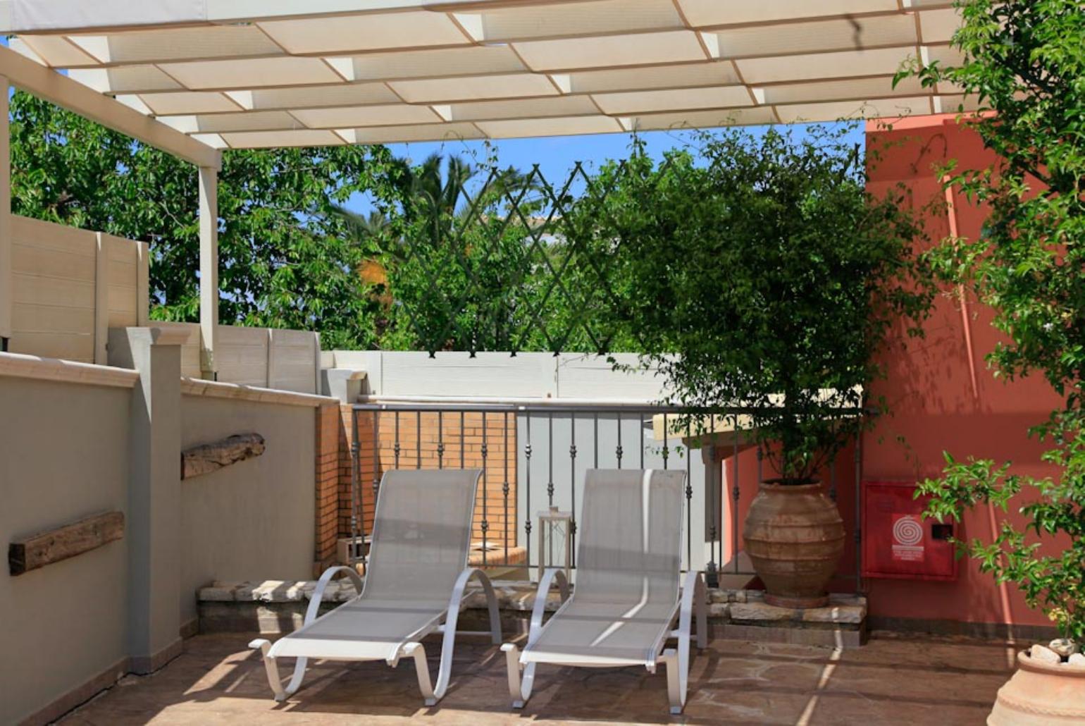 Shaded area with sun loungers
