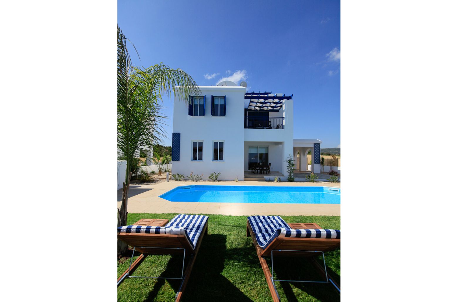 Private swimming pool with terrace and garden