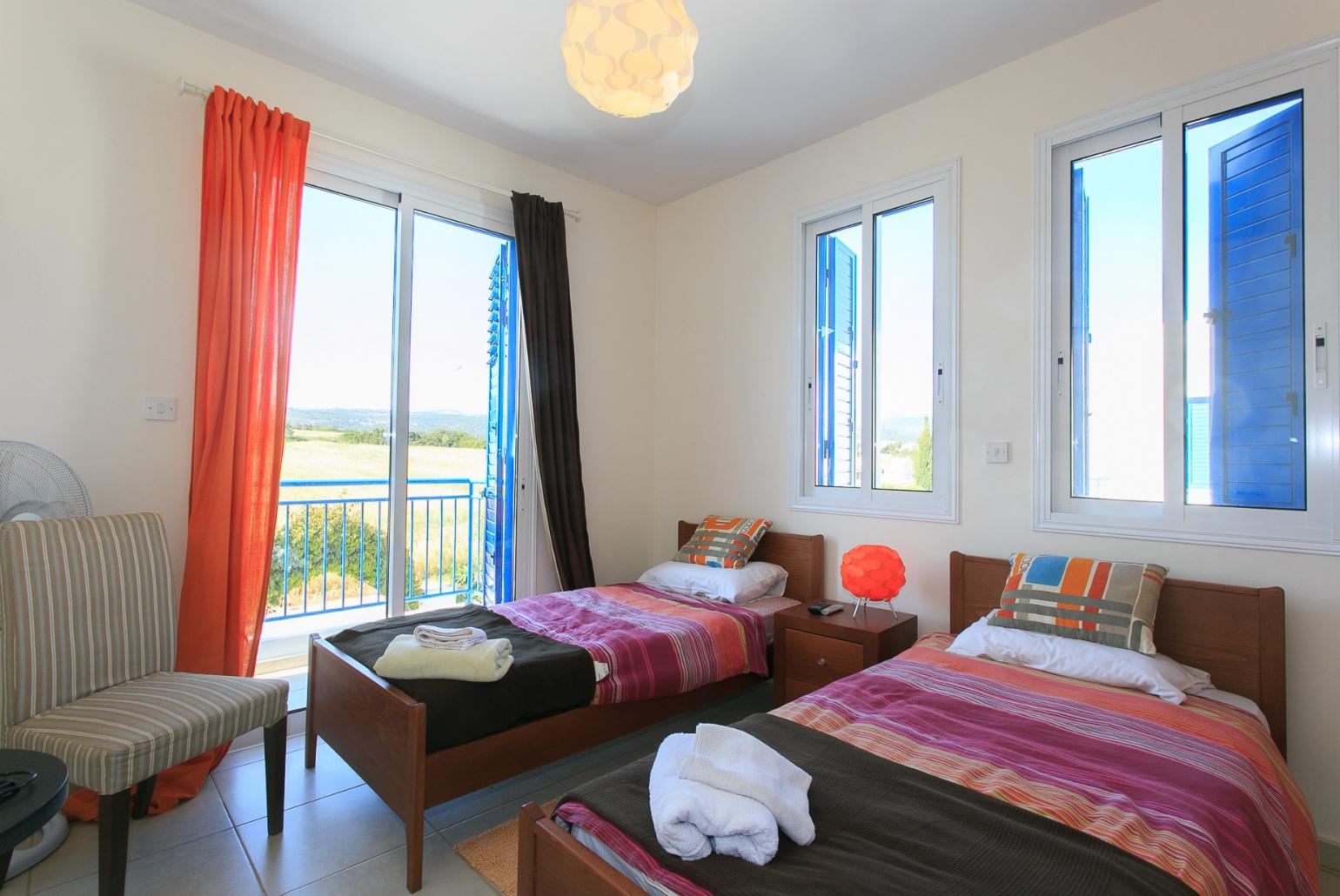 Twin bedroom with A/C and balcony access
