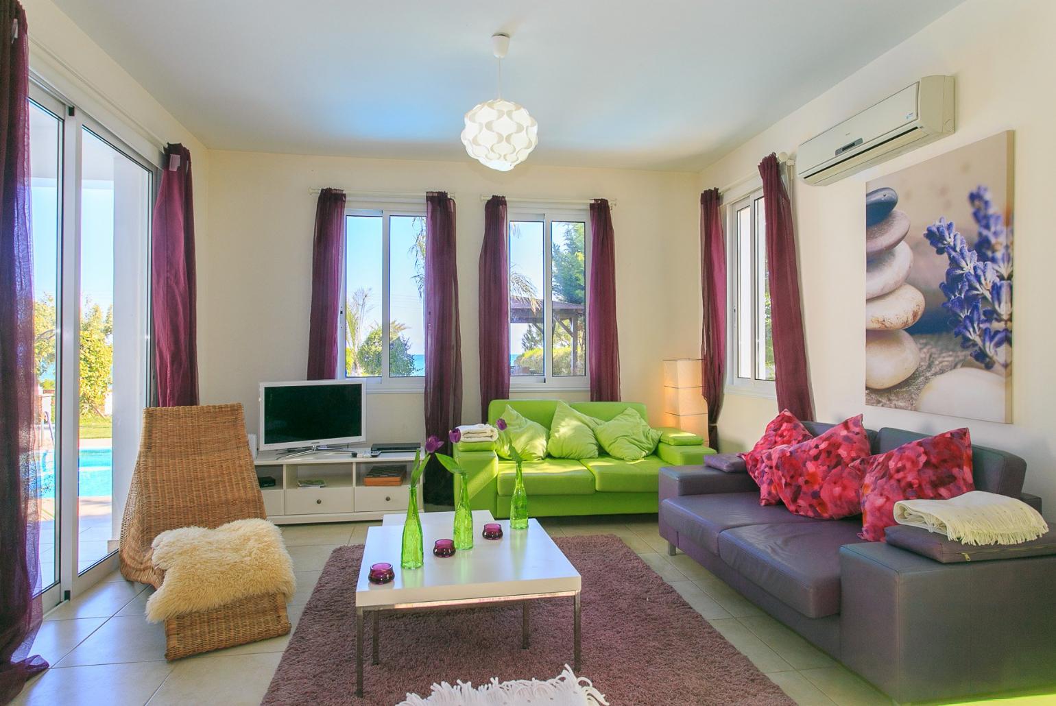 Open plan living area with WiFi, TV, DVD player and terrace access