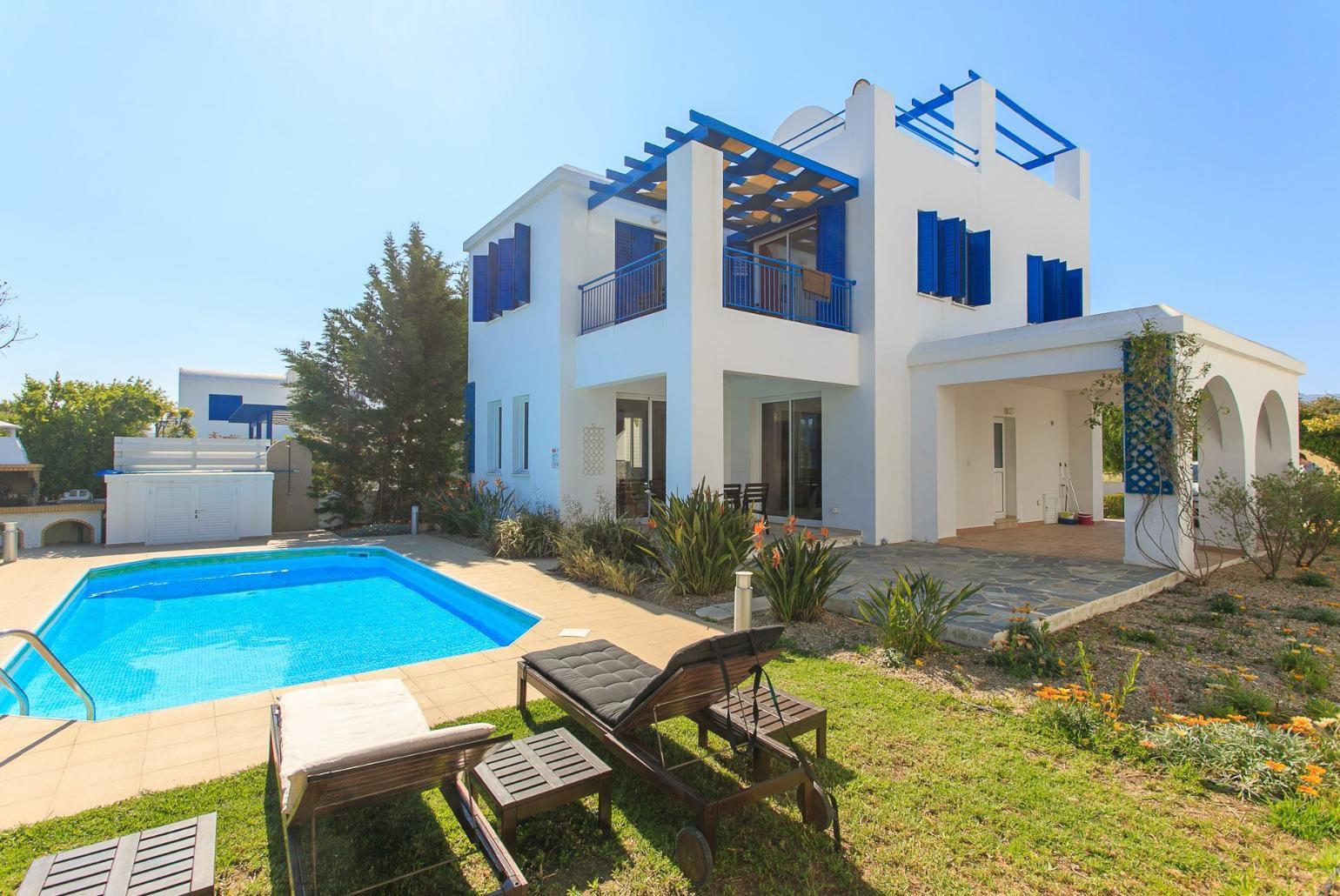 Private swimming pool with terrace and garden area
