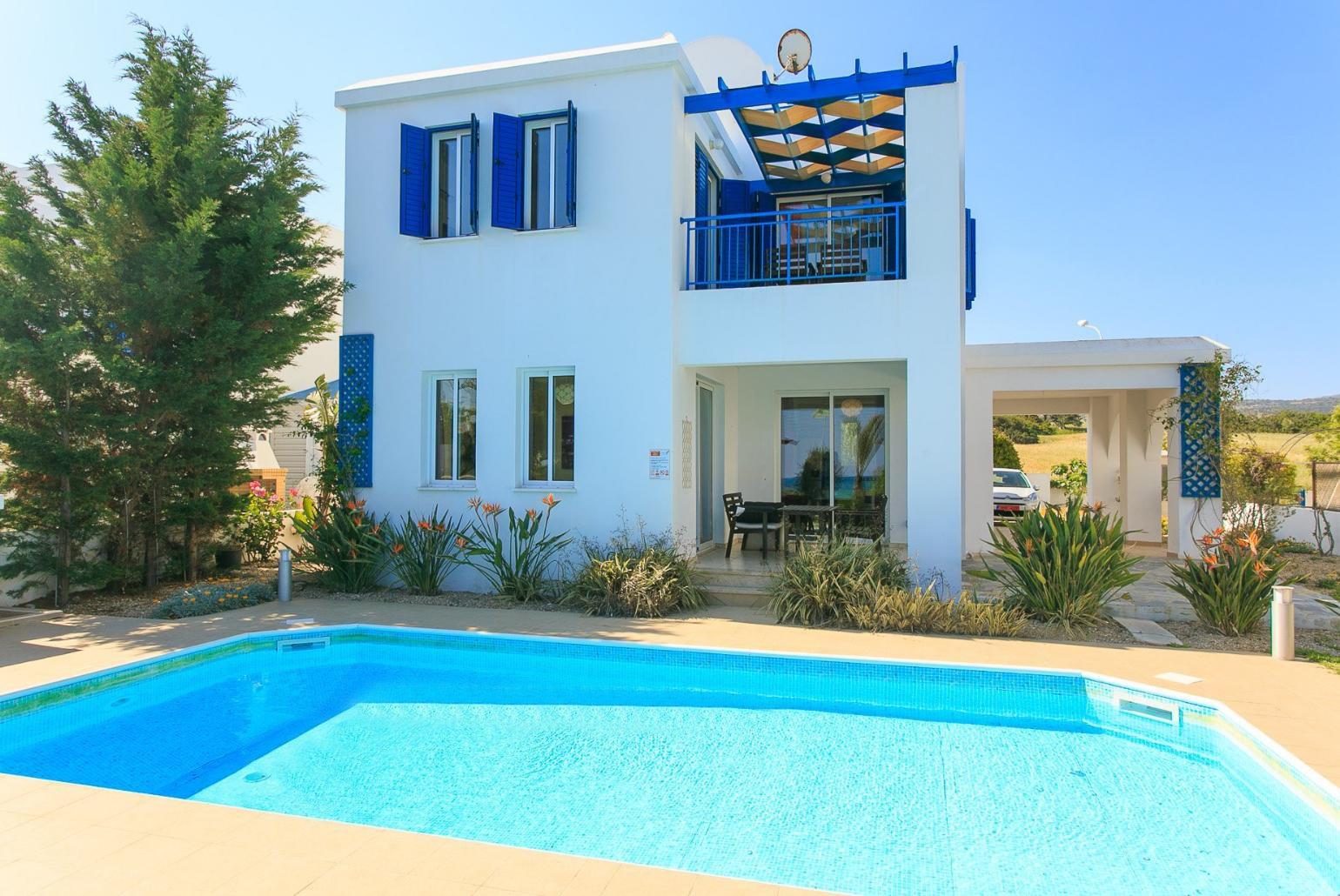 Private swimming pool with terrace and garden area