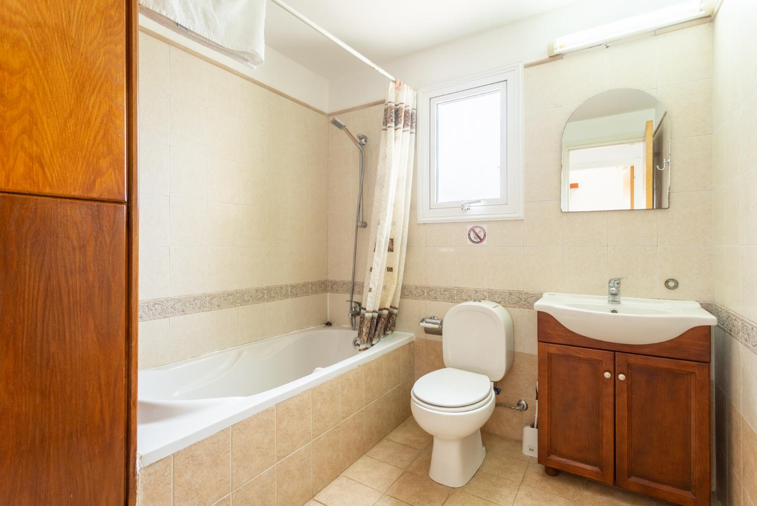 Family bathroom with bath and shower