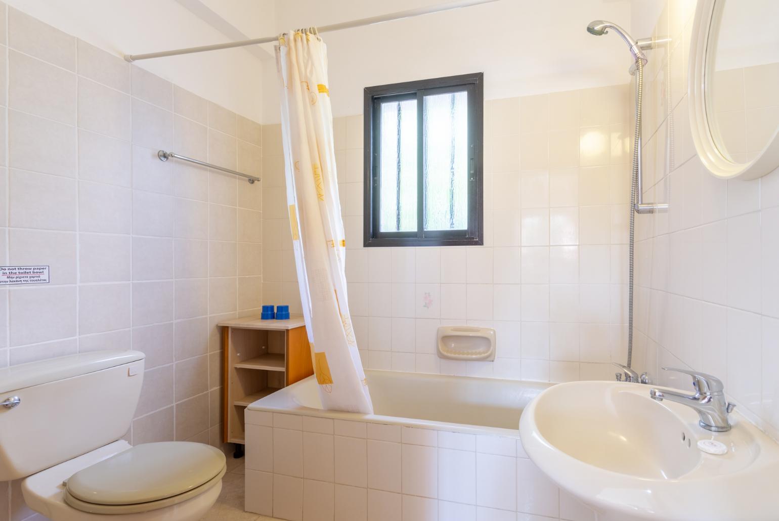 Family bathroom with bath and shower