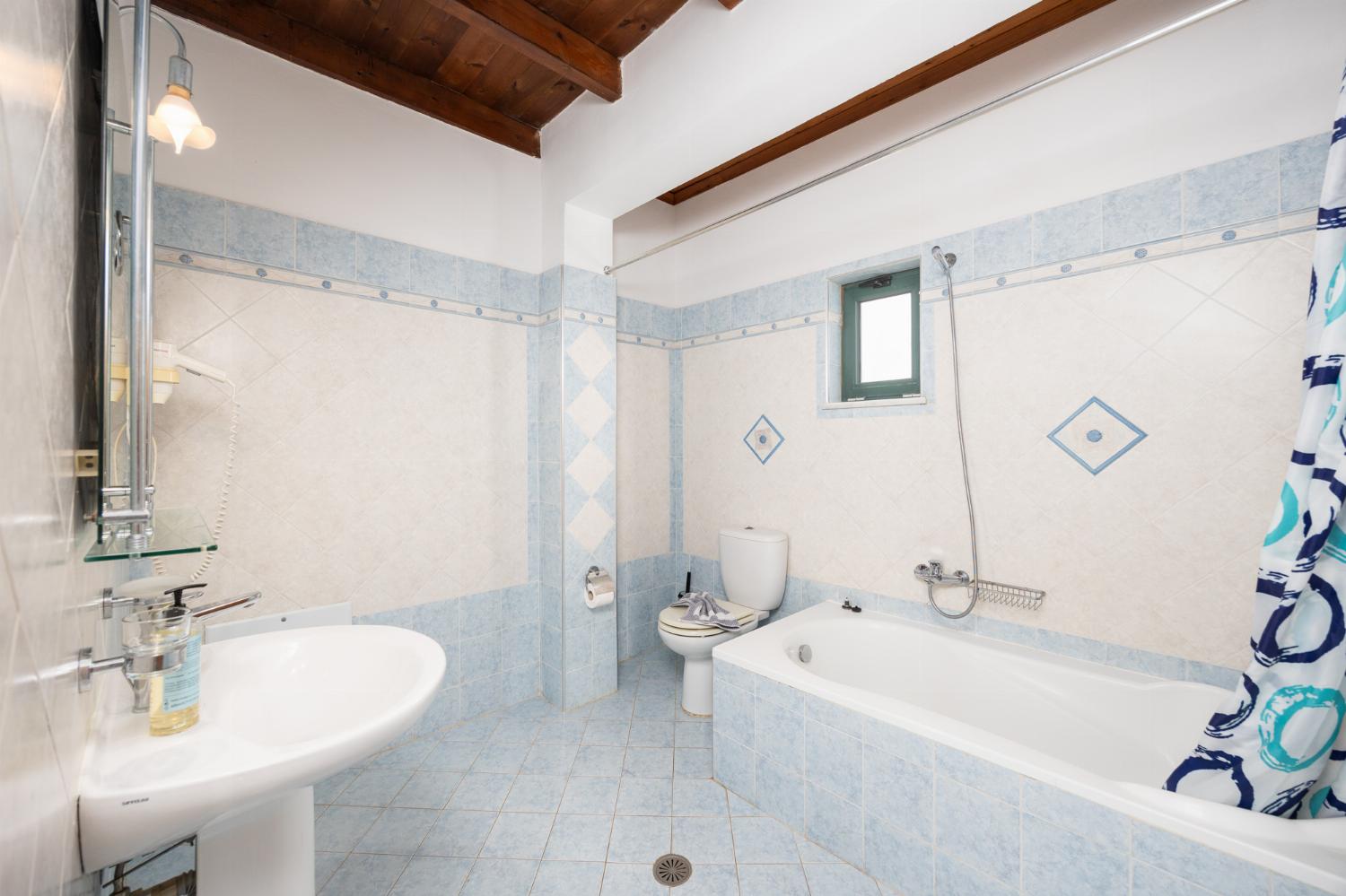 Upper unit: family bathroom with bath and shower