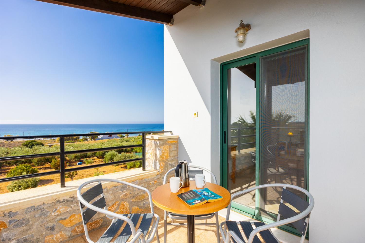 Upper unit: balcony with sea views