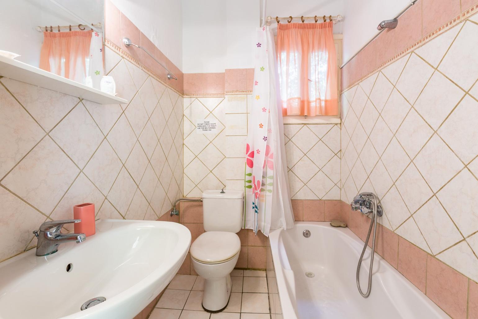 Bathroom with bath and overhead shower