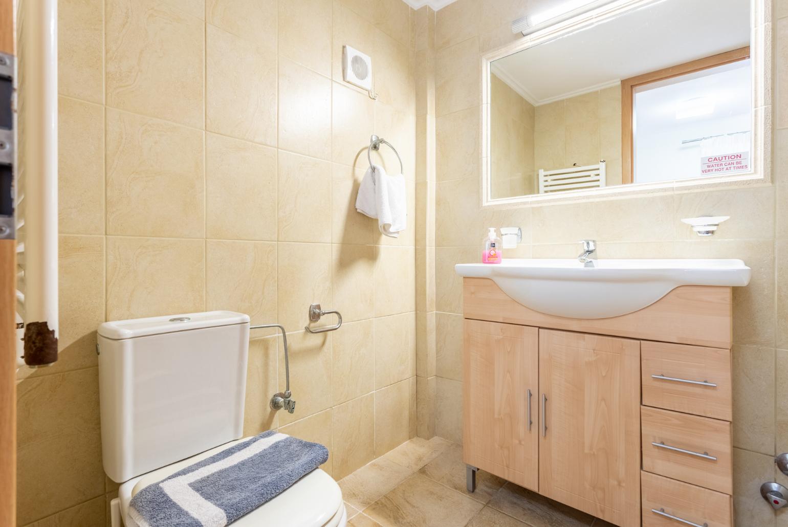 Family bathroom with bath and shower