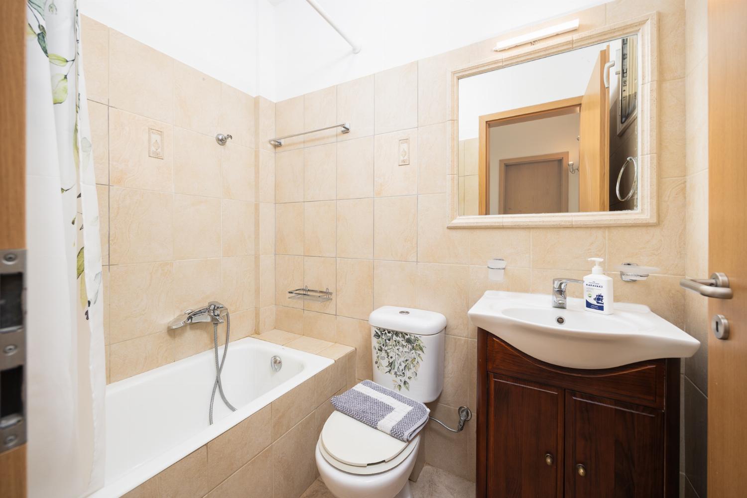 Family bathroom with bath and shower