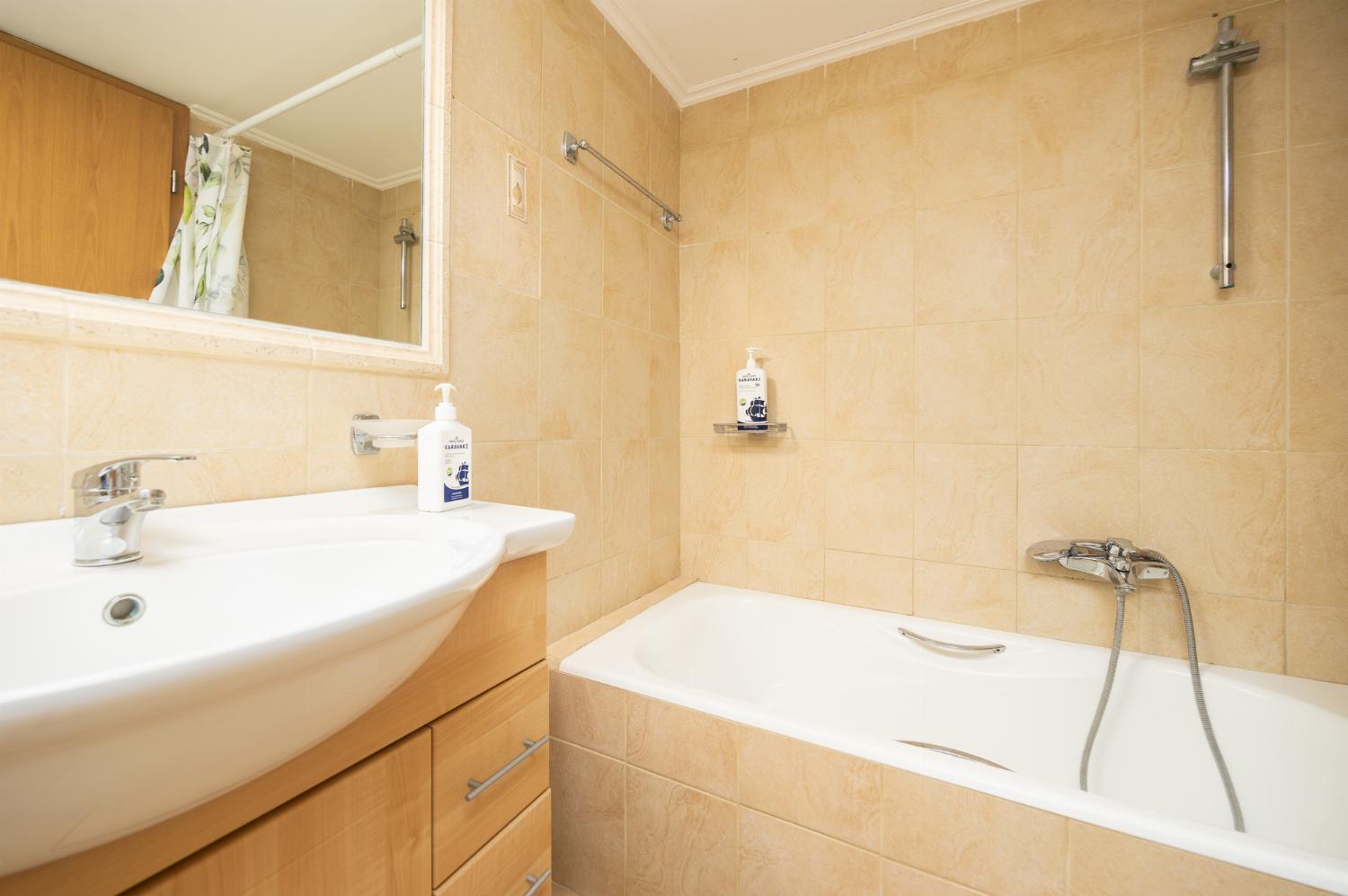 Family bathroom with bath and shower