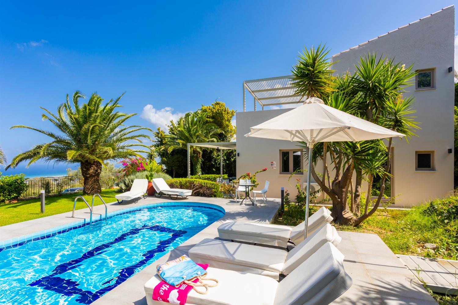 ,Beautiful villa with private pool, terrace, and garden with sea views