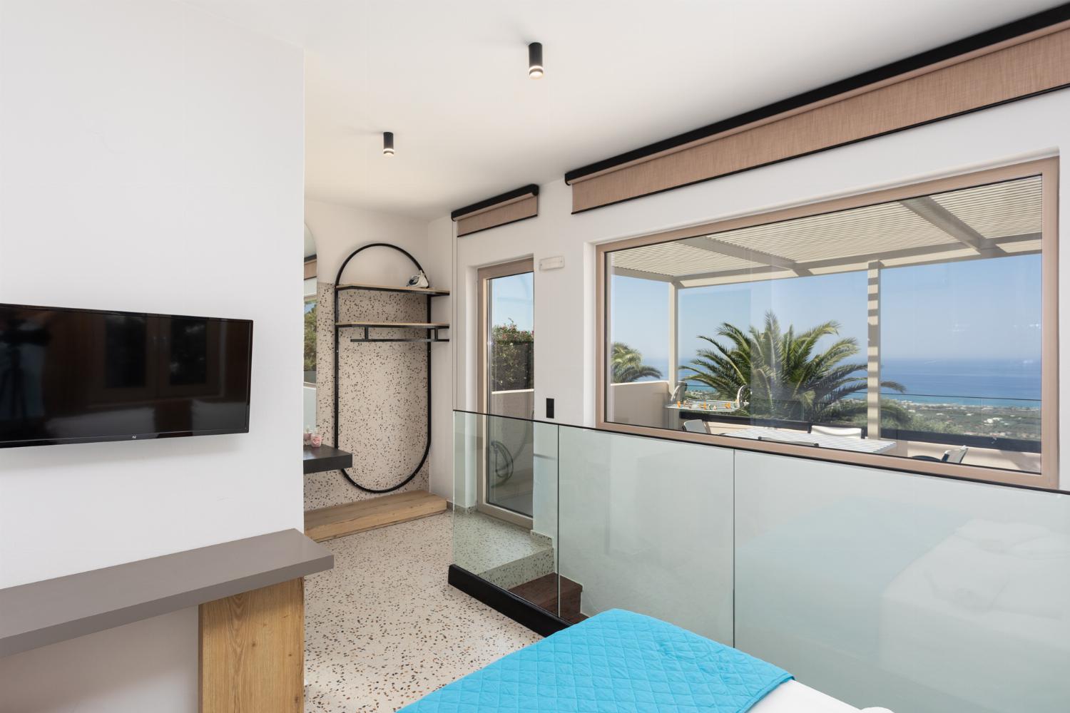 Double bedroom with en suite bathroom, A/C, and sea views