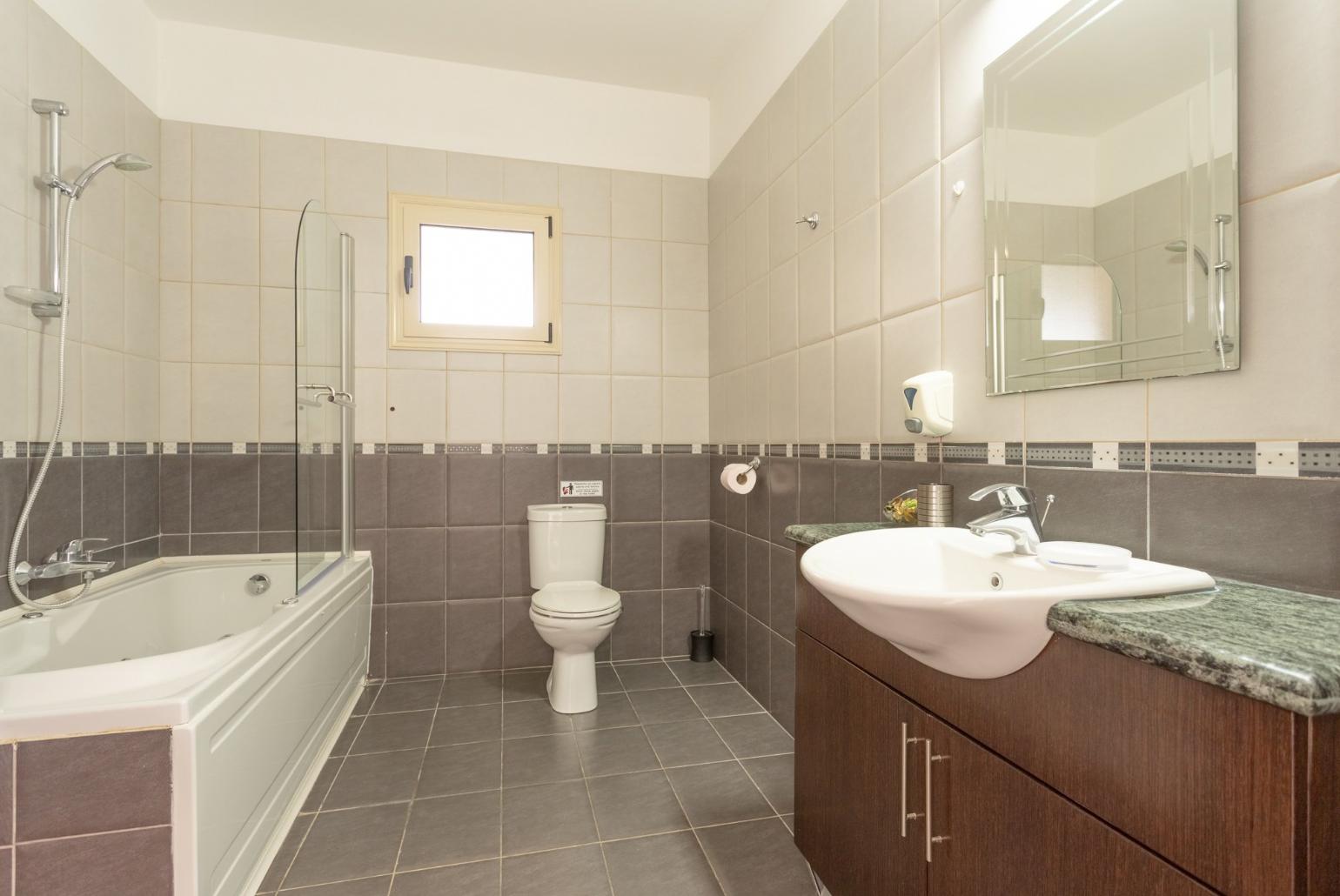 Family bathroom with bath and shower